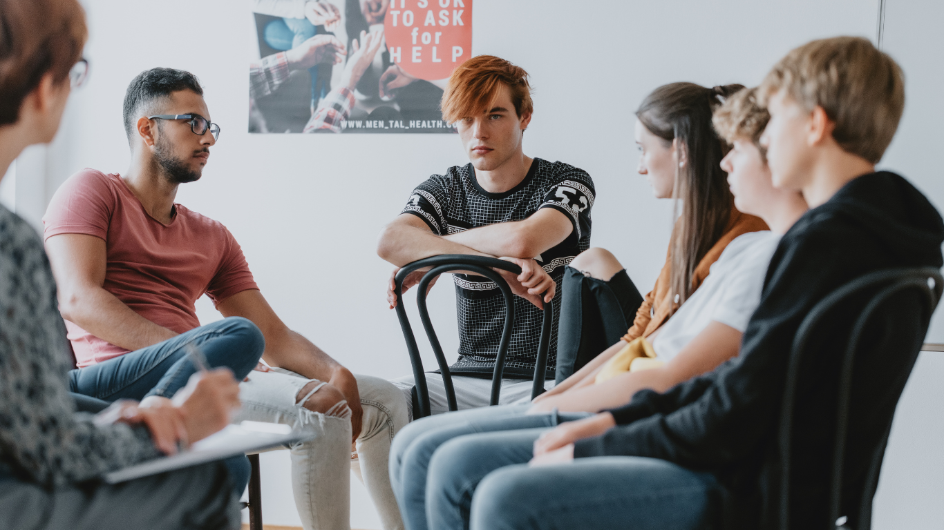 A group of young people getting learning support.